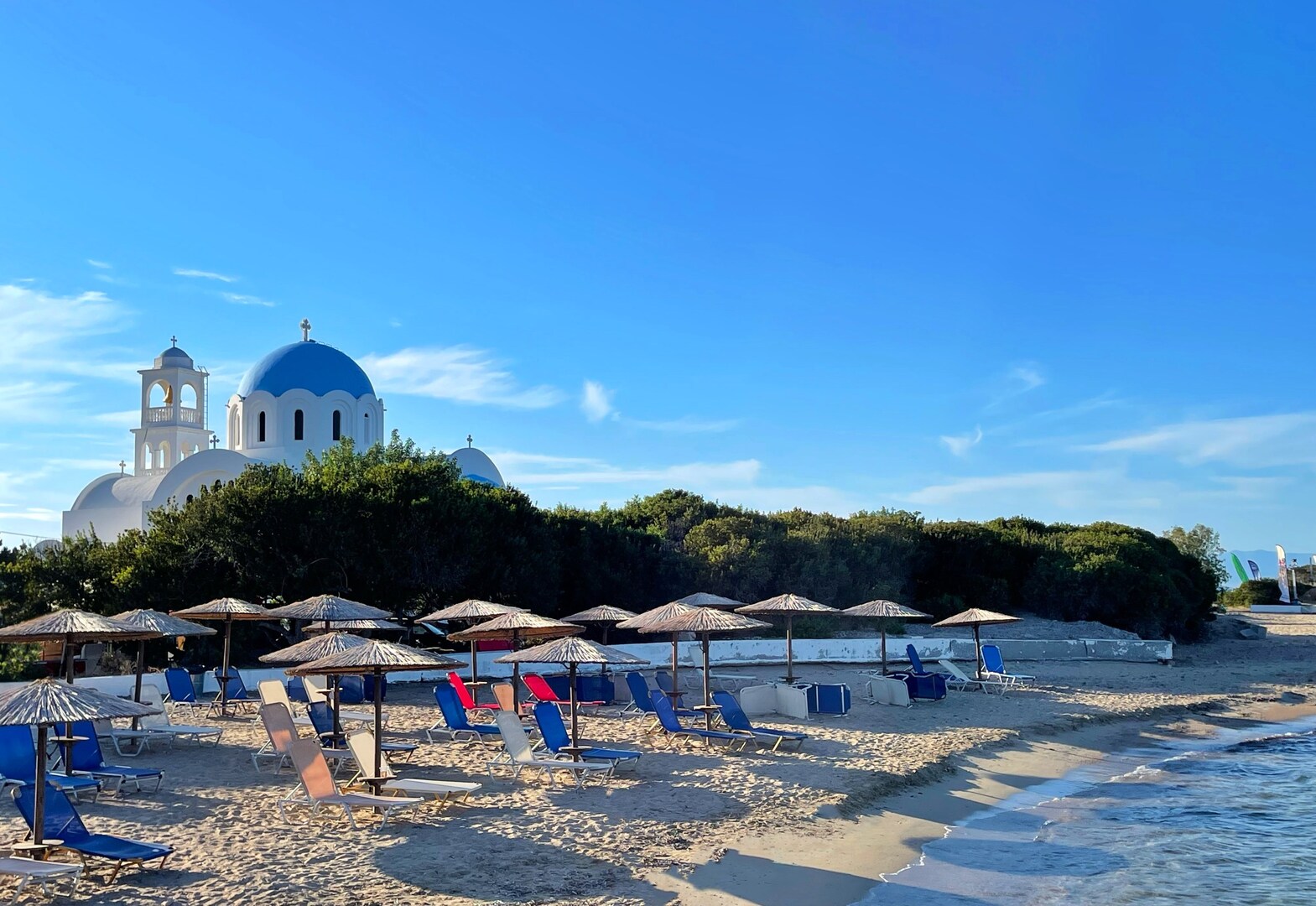 Church and beach on Agistri, one of the best quiet Greek islands.