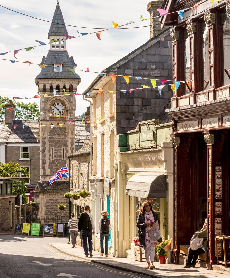 Lion Street in Hay-on-Wye during the book festival, showing Richard Booth's bookshop and the Victorian clock tower.