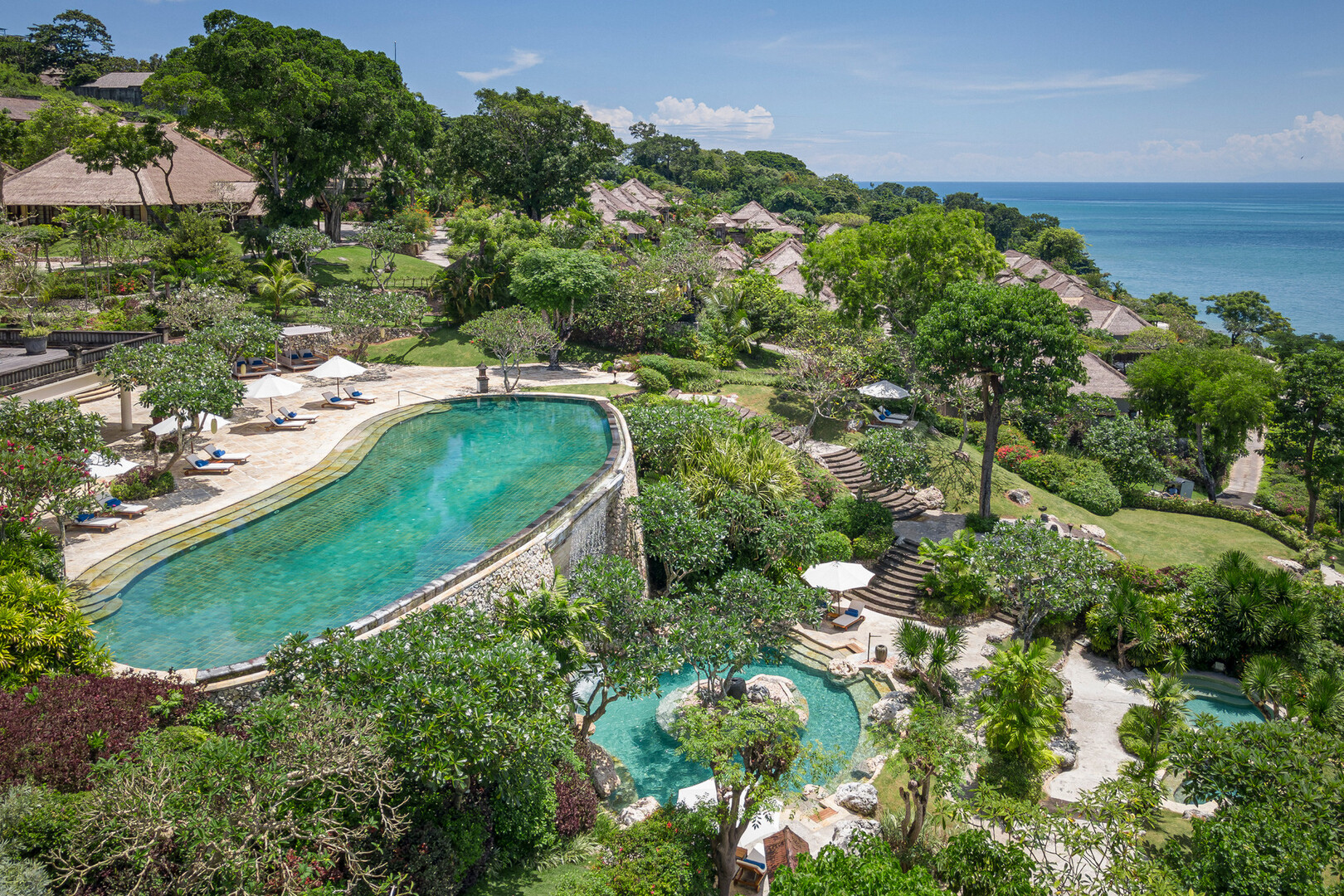 Terraced pools at Four Seasons Jimbaran Bay, part of the list of the best romantic accommodations in Bali.