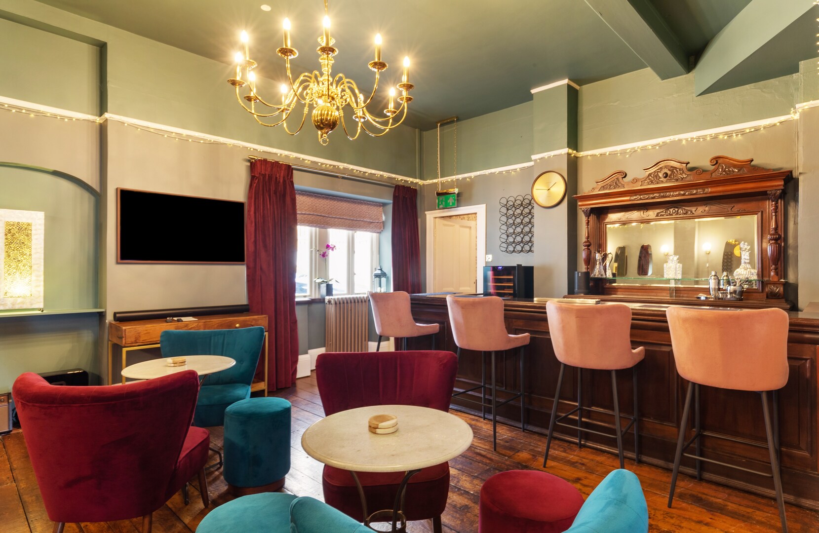 Lounge area with bar and velvet seating.