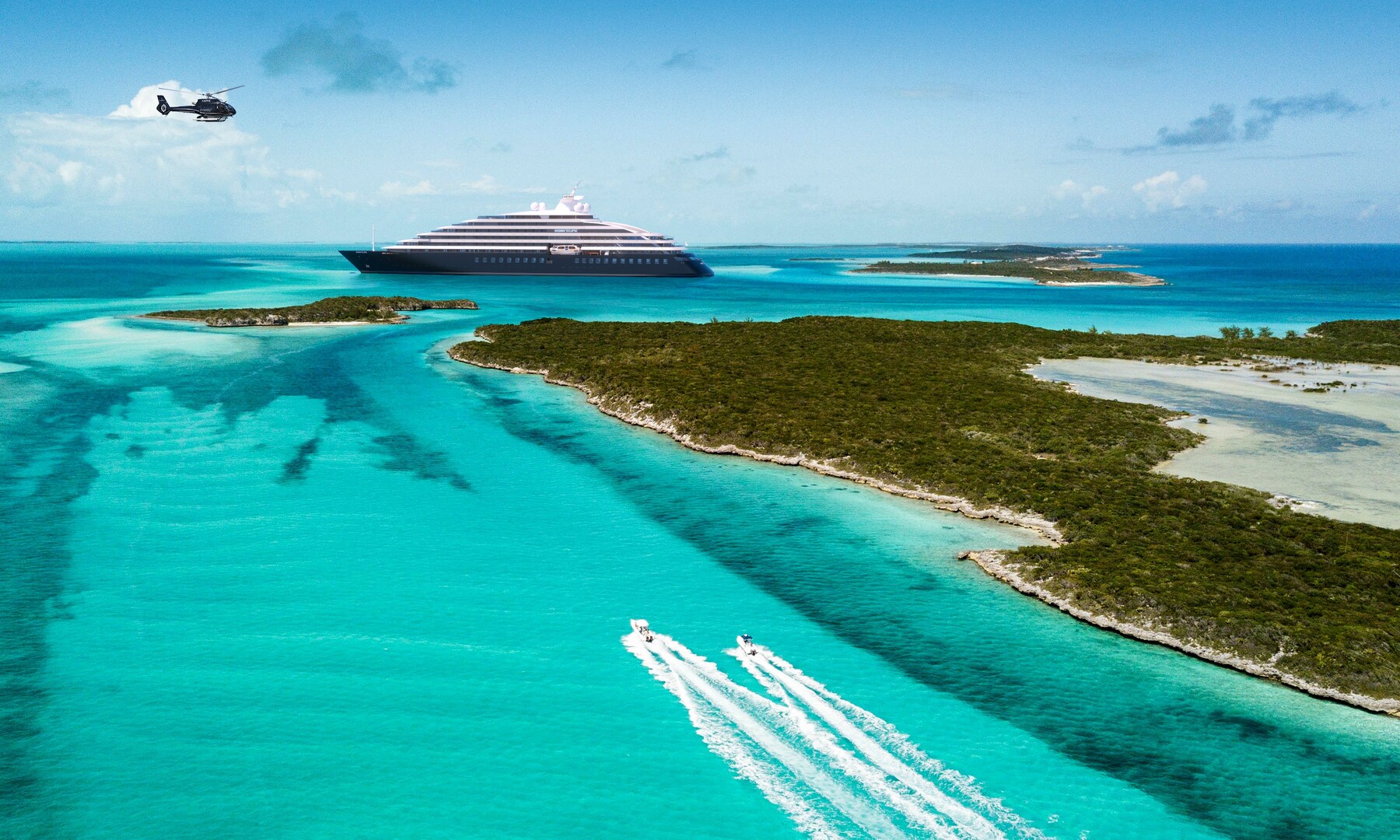 Aerial view of a cruise ship and boats in Exuma, Bahamas.