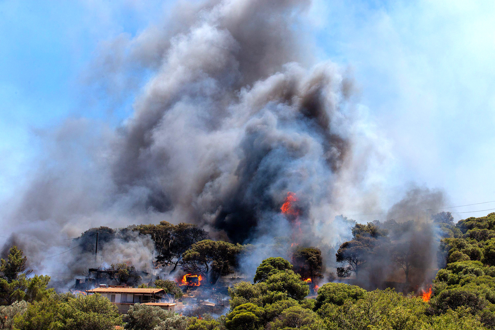 Smoke rising from a wildfire in Greece, 2024