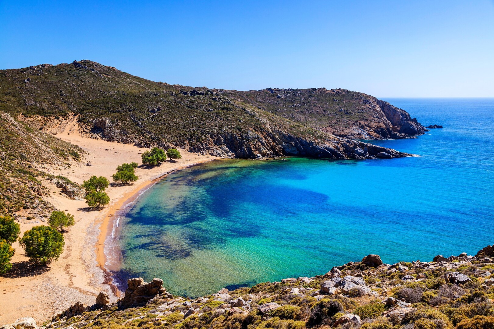 Psili Ammos beach on Patmos, one of the best quiet Greek islands.