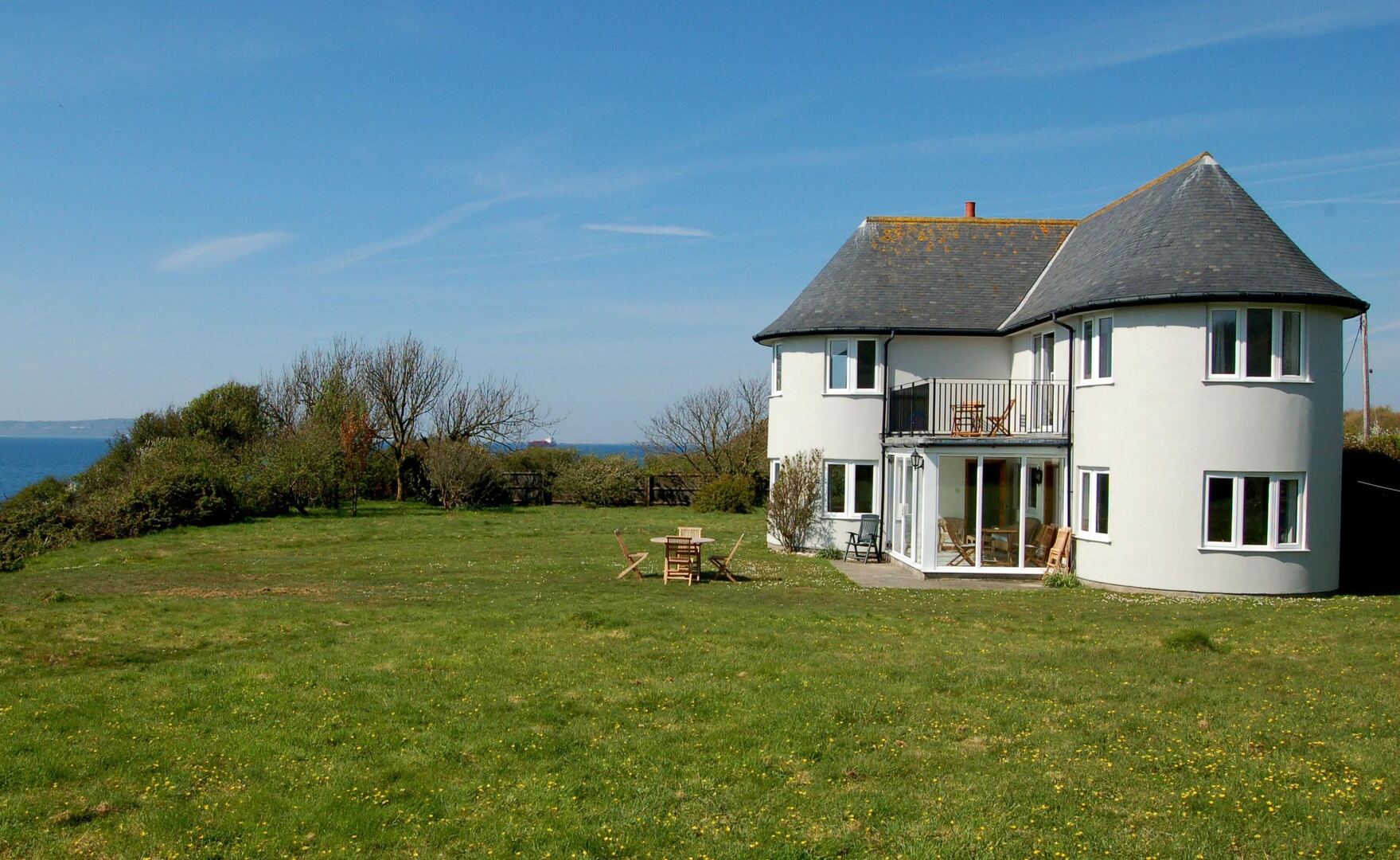 Shore Cottage in Ringstead Bay, overlooking the sea.
